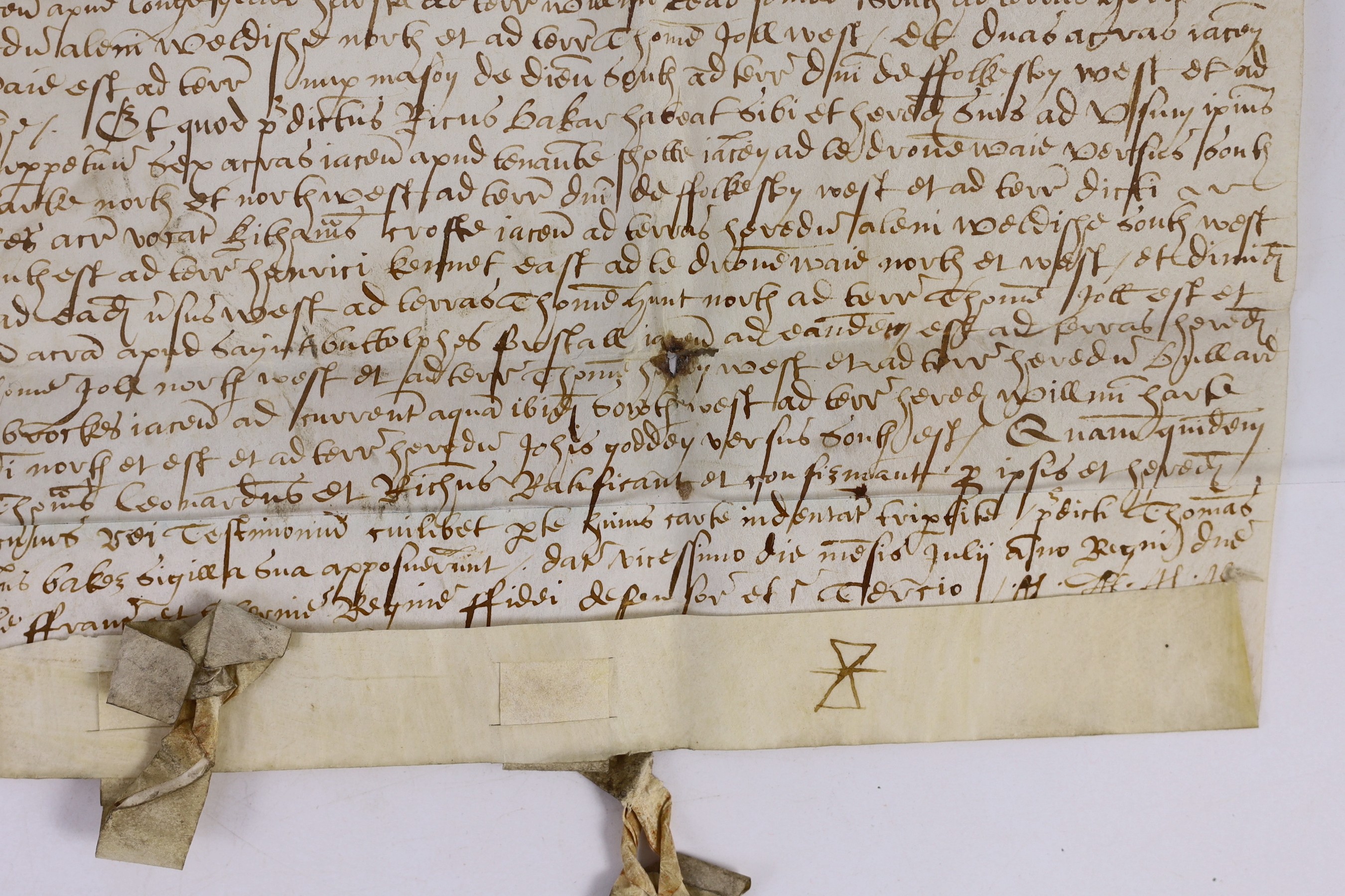 An Elizabethan charter recording the division of property, in Latin, in black ink on vellum, 30 x 37cms.